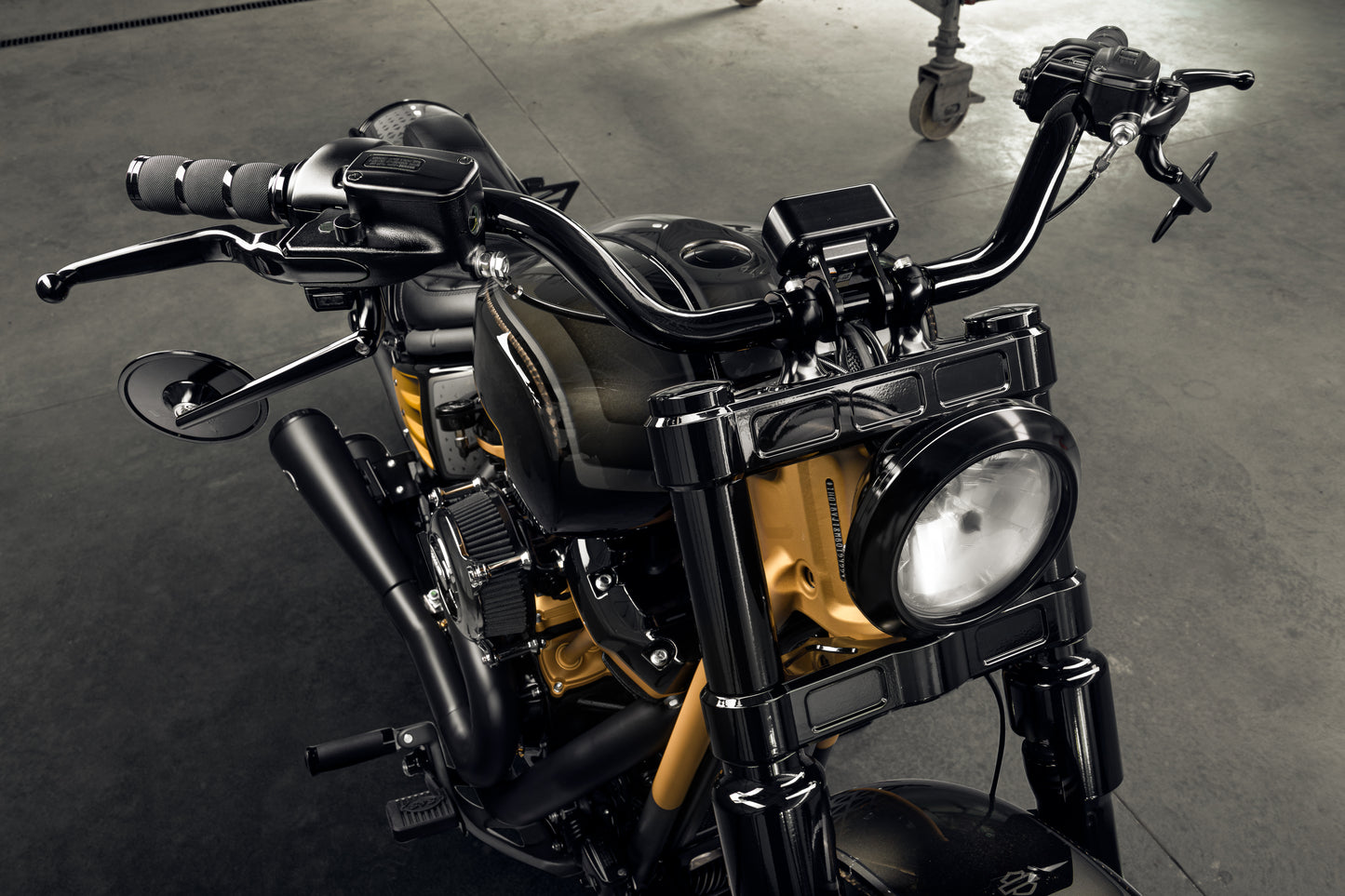 Harley Davidson motorcycle with Killer Custom "Classic" mirrors from the front in an industrial environment