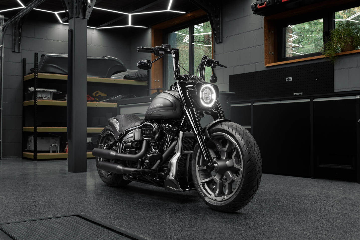 Harley Davidson motorcycle with Killer Custom "Killer Bull" fat handlebars from the front in a modern bike shop