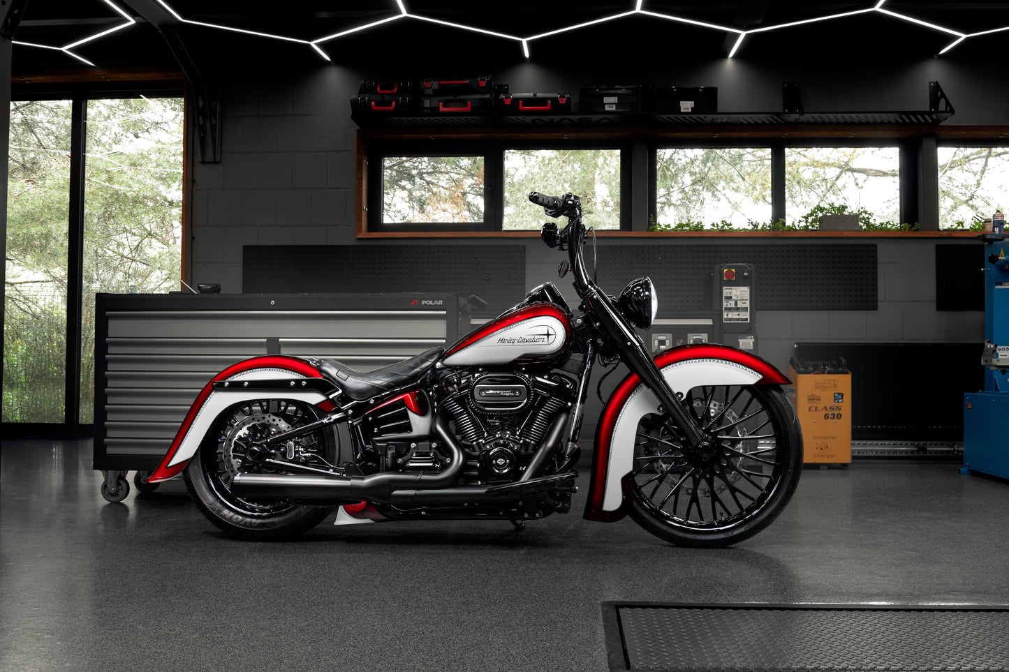 Harley Davidson motorcycle with Killer Custom "Hot rod series" front fender from the side in an industrial environment