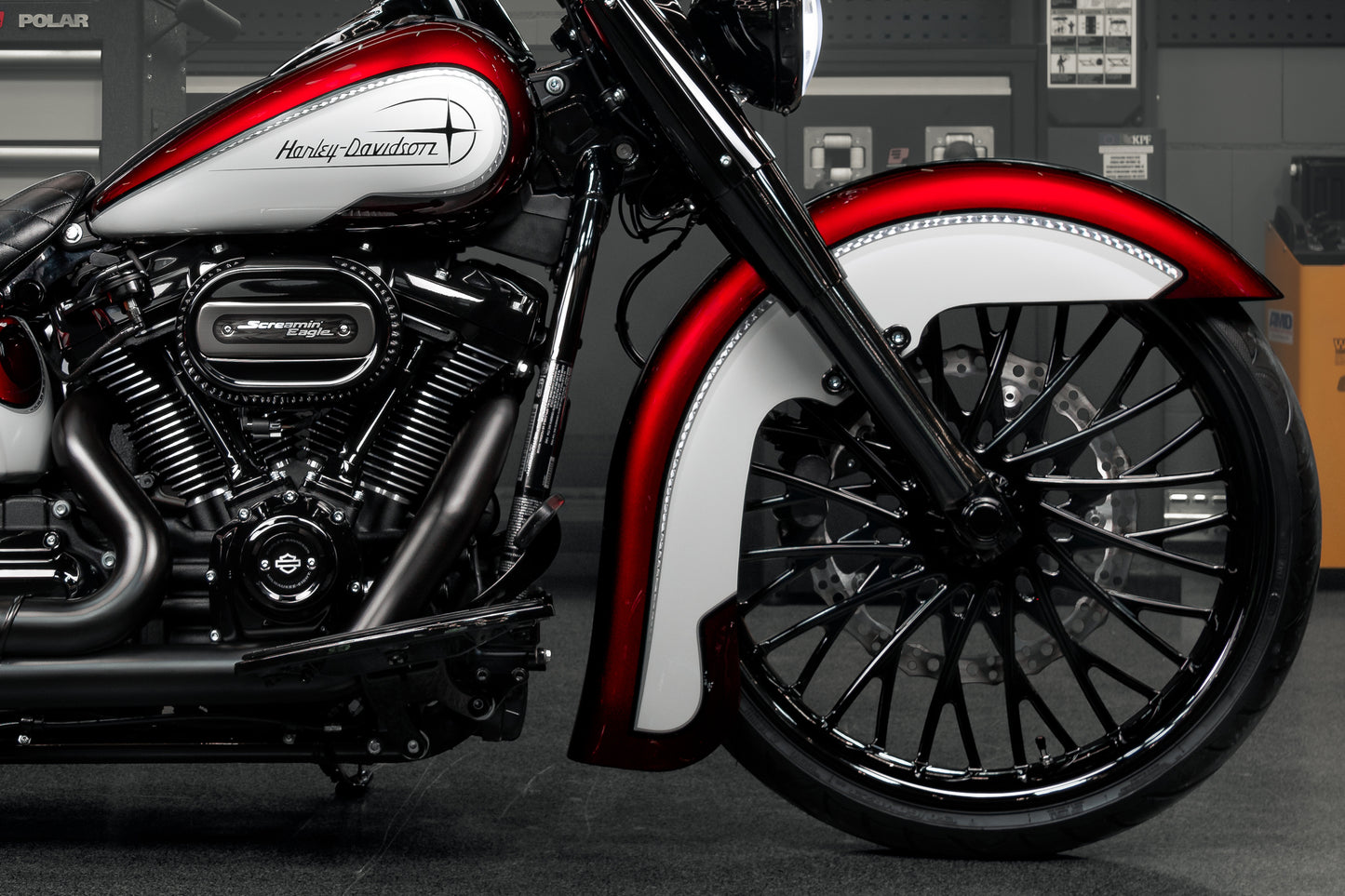 Harley Davidson motorcycle with Killer Custom "Hot rod series" front fender from the side in an industrial environment