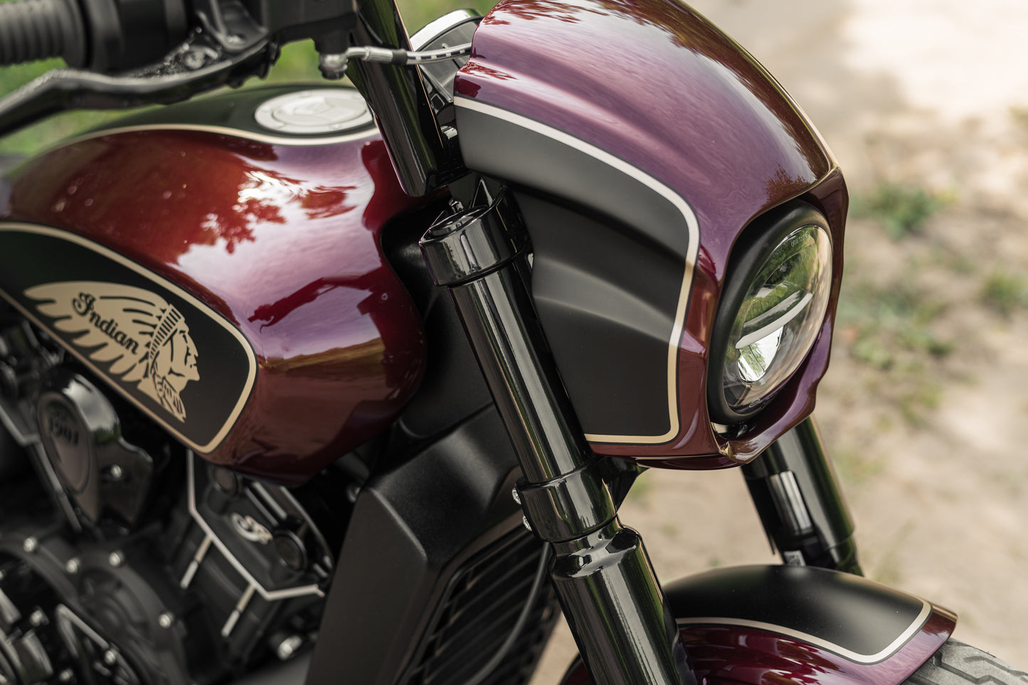 Zoomed Harley Davidson motorcycle with Killer Custom upper fork covers from above on a roadside