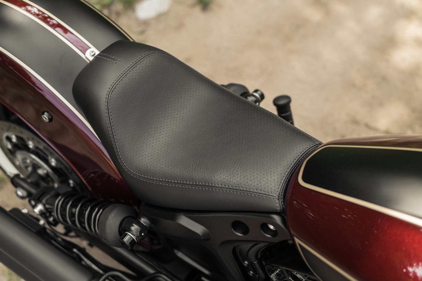 Harley Davidson motorcycle with Killer Custom Indian scout solo seat from above neutral background