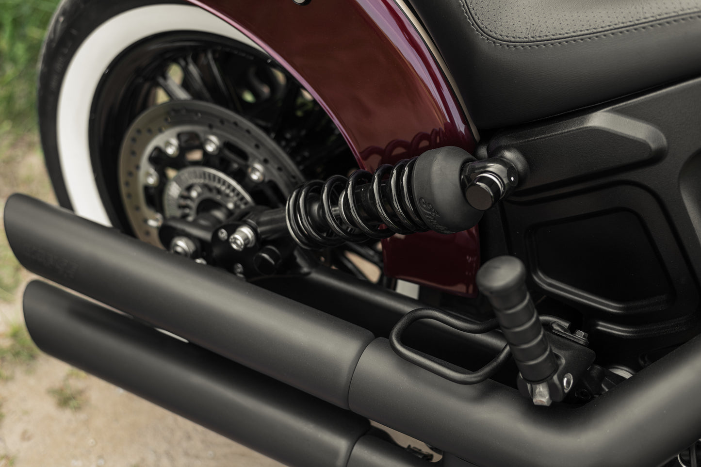 Zoomed Harley Davidson motorcycle with Killer Custom rear shock bolt covers