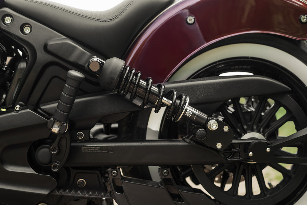 Zoomed Harley Davidson motorcycle with Killer Custom rear shock lowering kit from the side