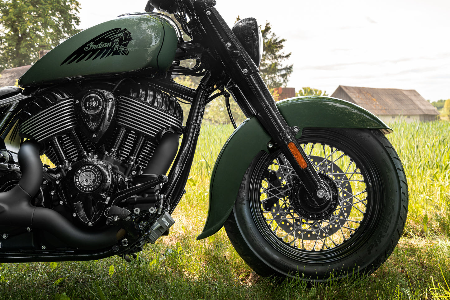 Harley Davidson motorcycle with Killer Custom "Apache" front fender from the side on the countryside