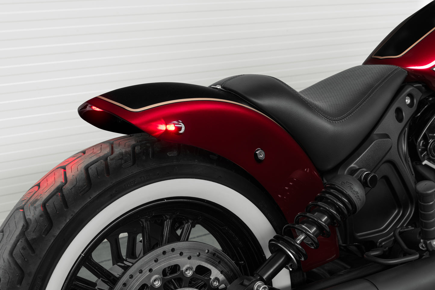 Harley Davidson motorcycle with Killer Custom "Tomahawk" rear fender from the side white background