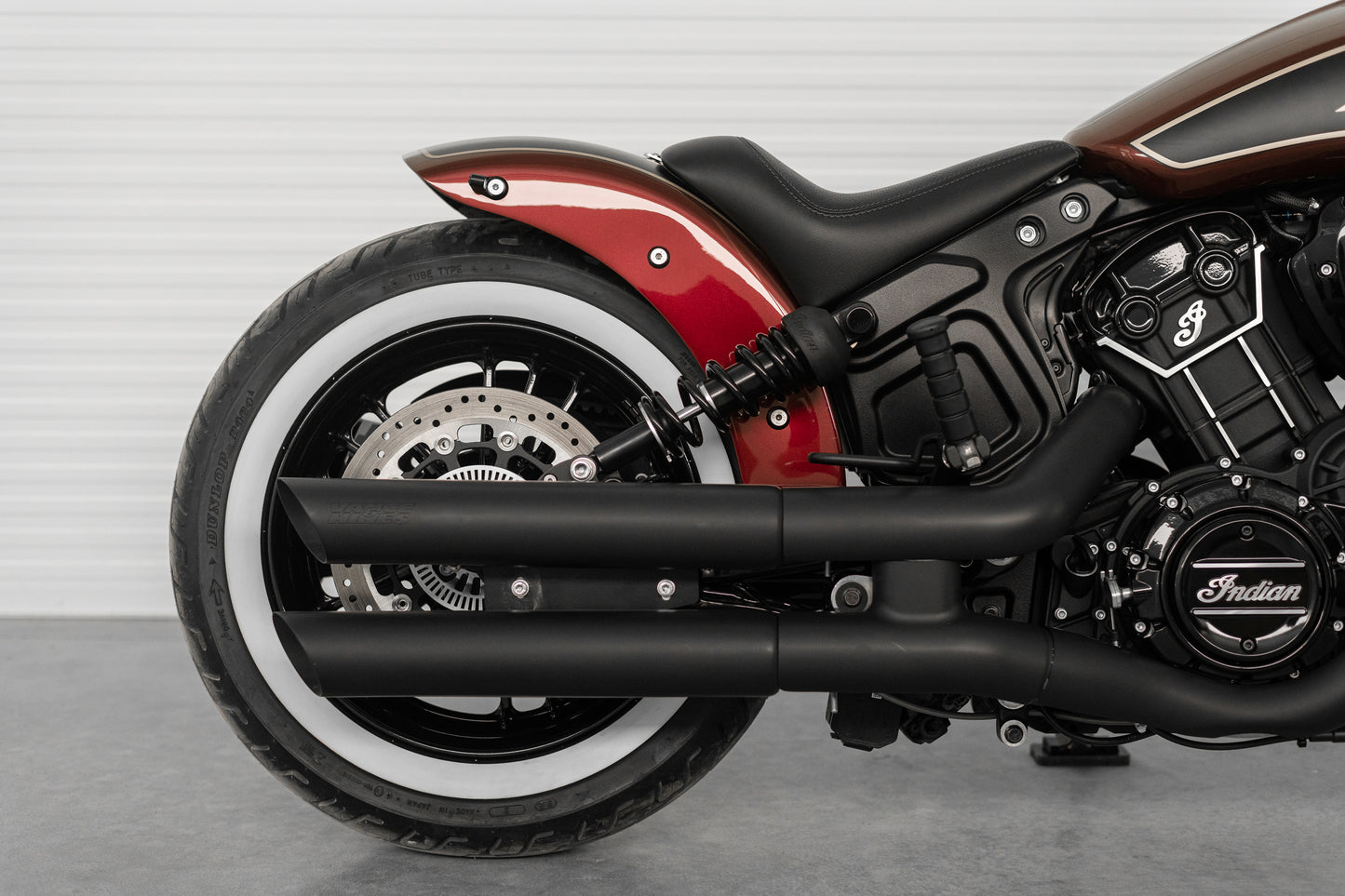 Harley Davidson motorcycle with Killer Custom  rear shock lowering kit from the side neutral background