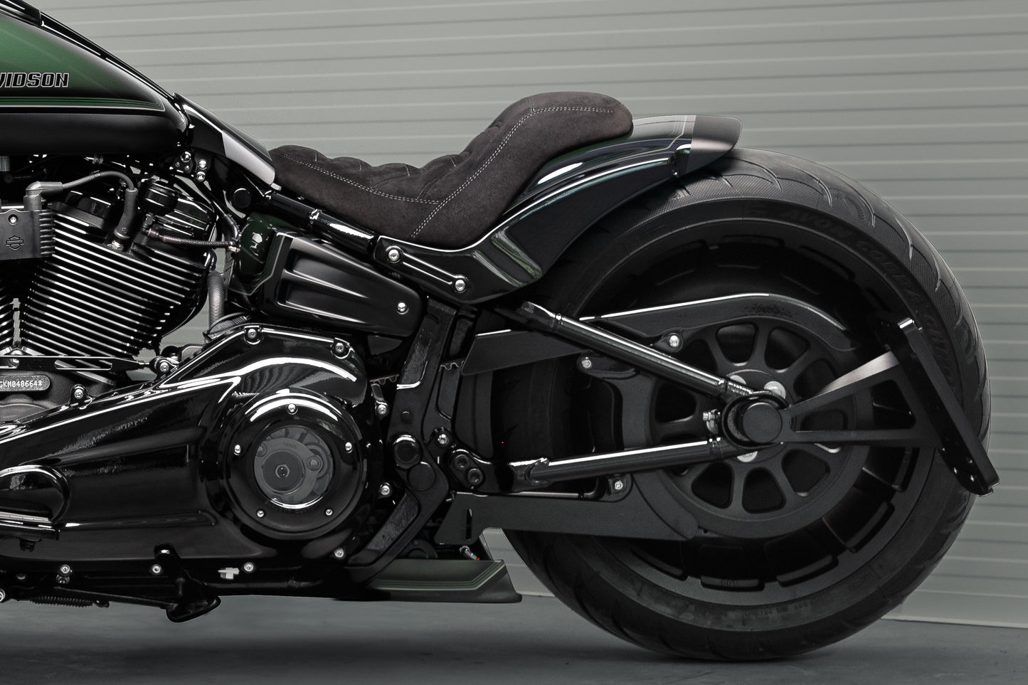 Zoomed Harley Davidson motorcycle with Killer Custom "Avenger" rear fender kit from the side