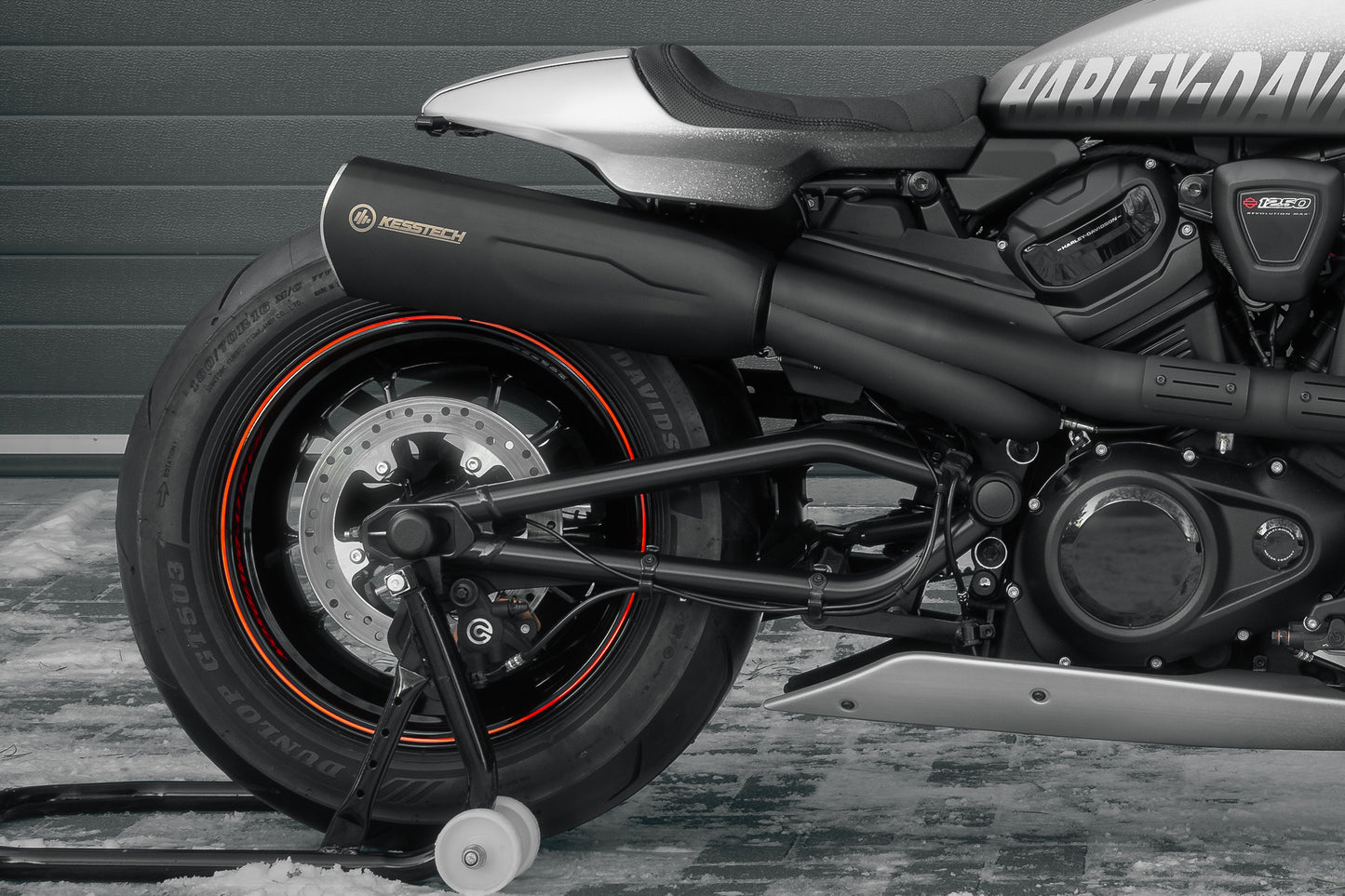 Harley Davidson motorcycle with Killer Custom "Sporty" seat from the side with visible snow on the ground