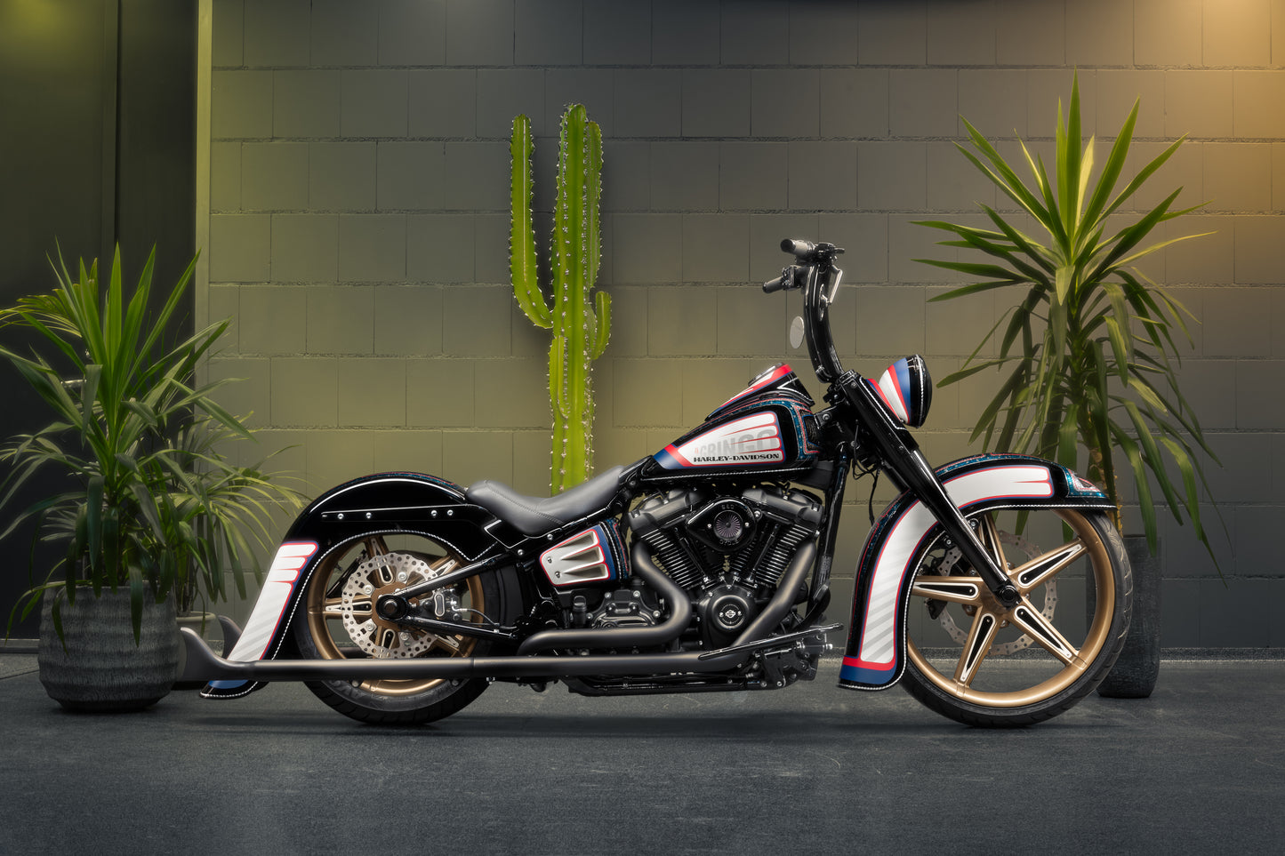 Harley Davidson motorcycle with Killer Custom rear fender from the side in an industrial environment