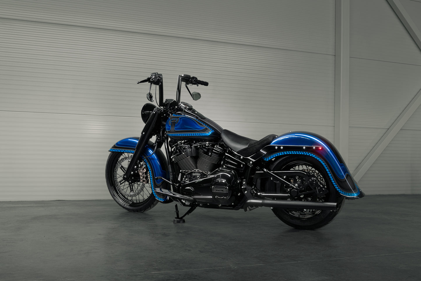 Harley Davidson motorcycle with Killer Custom parts from the side in a modern white garage