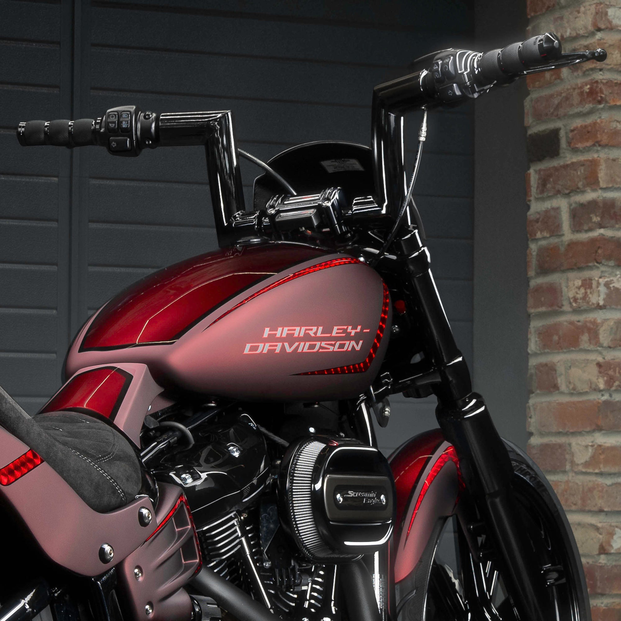 Zoomed Harley Davidson motorcycle with Killer Custom parts from the rear in a modern garage