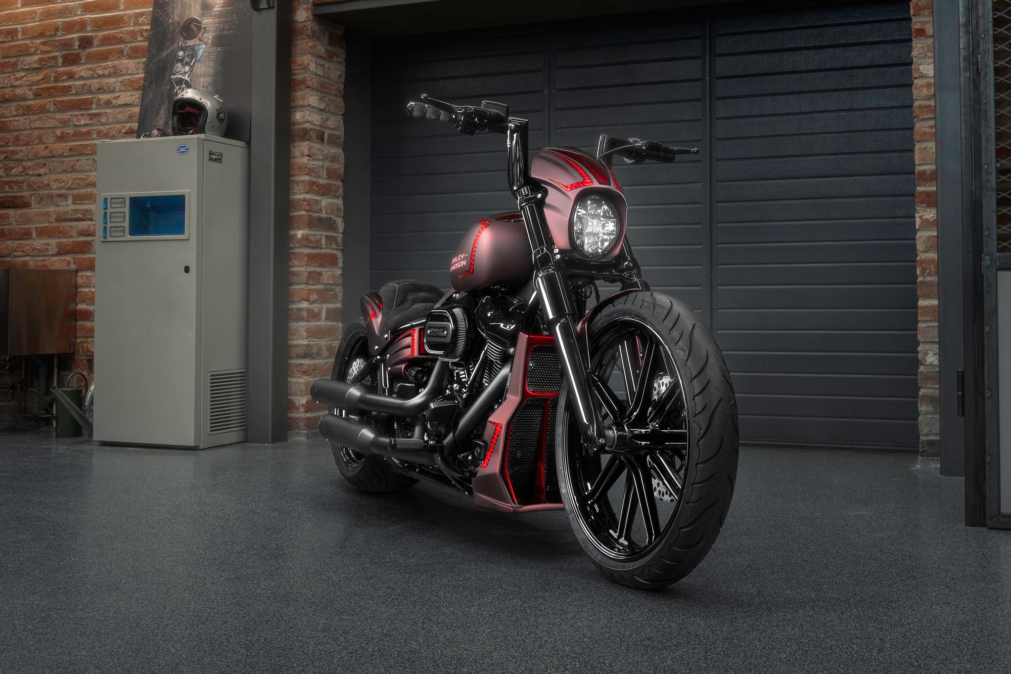 Zoomed Harley Davidson motorcycle with Killer Custom parts from the front in a modern garage