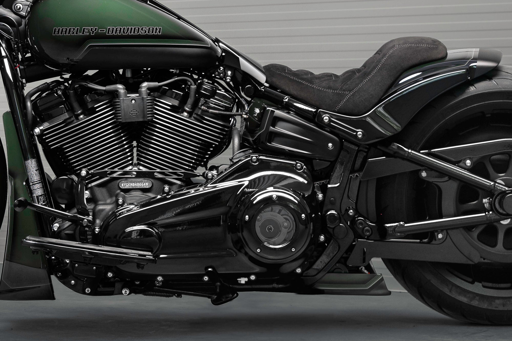 Zoomed Harley Davidson Fat Boy motorcycle with Killer Custom parts from the side neutral background