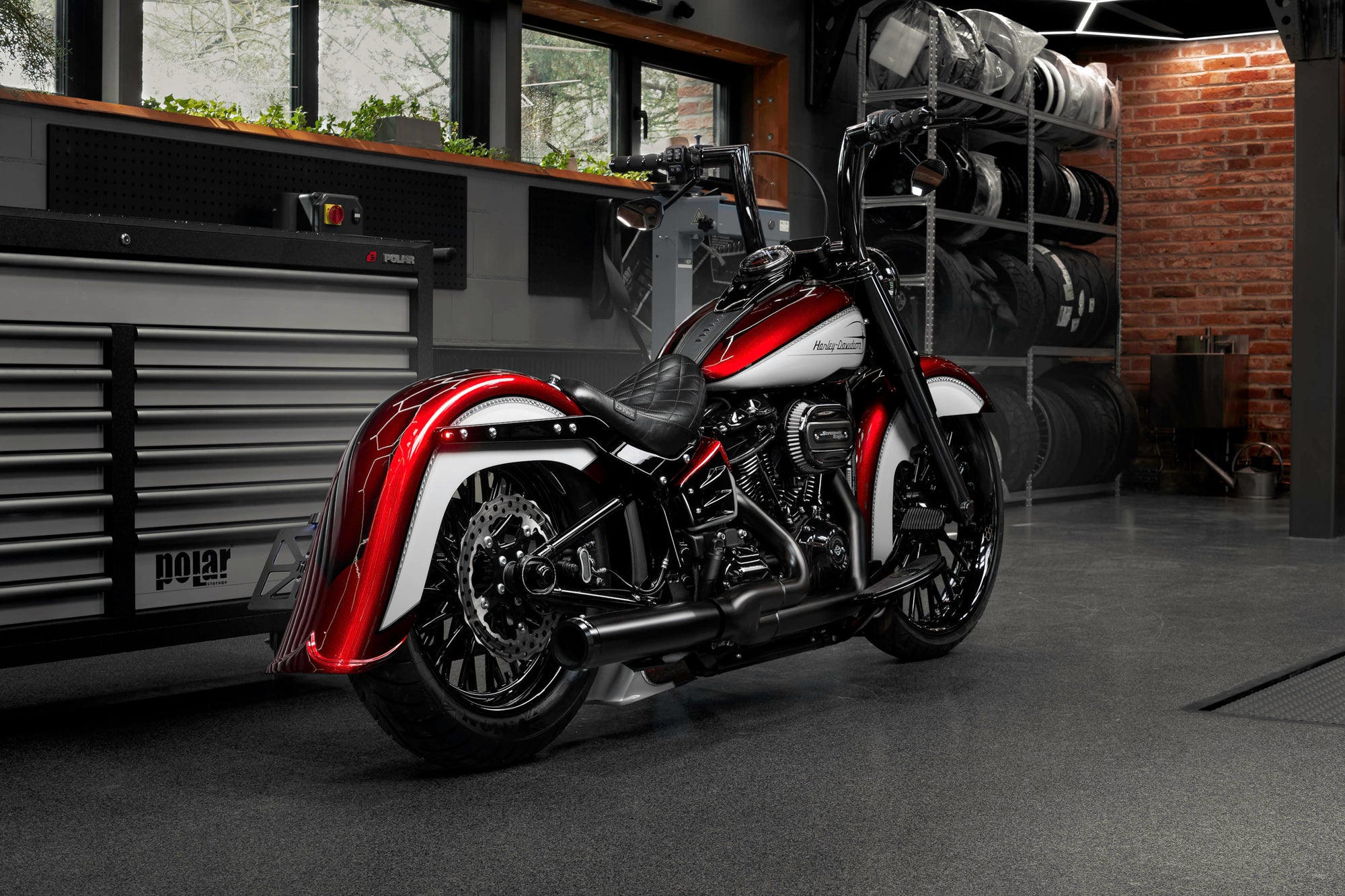 Harley Davidson motorcycle with Killer Custom parts from the side in a modern bike shop