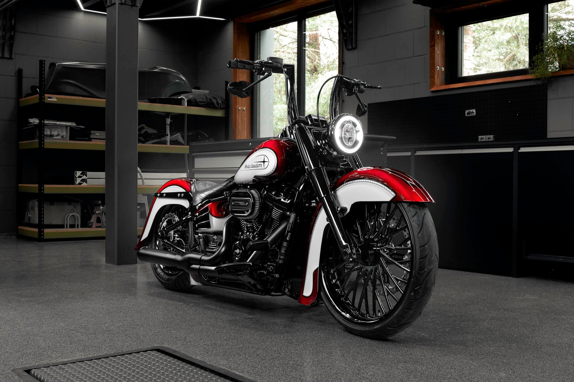 Modified Harley Davidson Heritage motorcycle with Killer Custom parts from the front in a modern bike shop