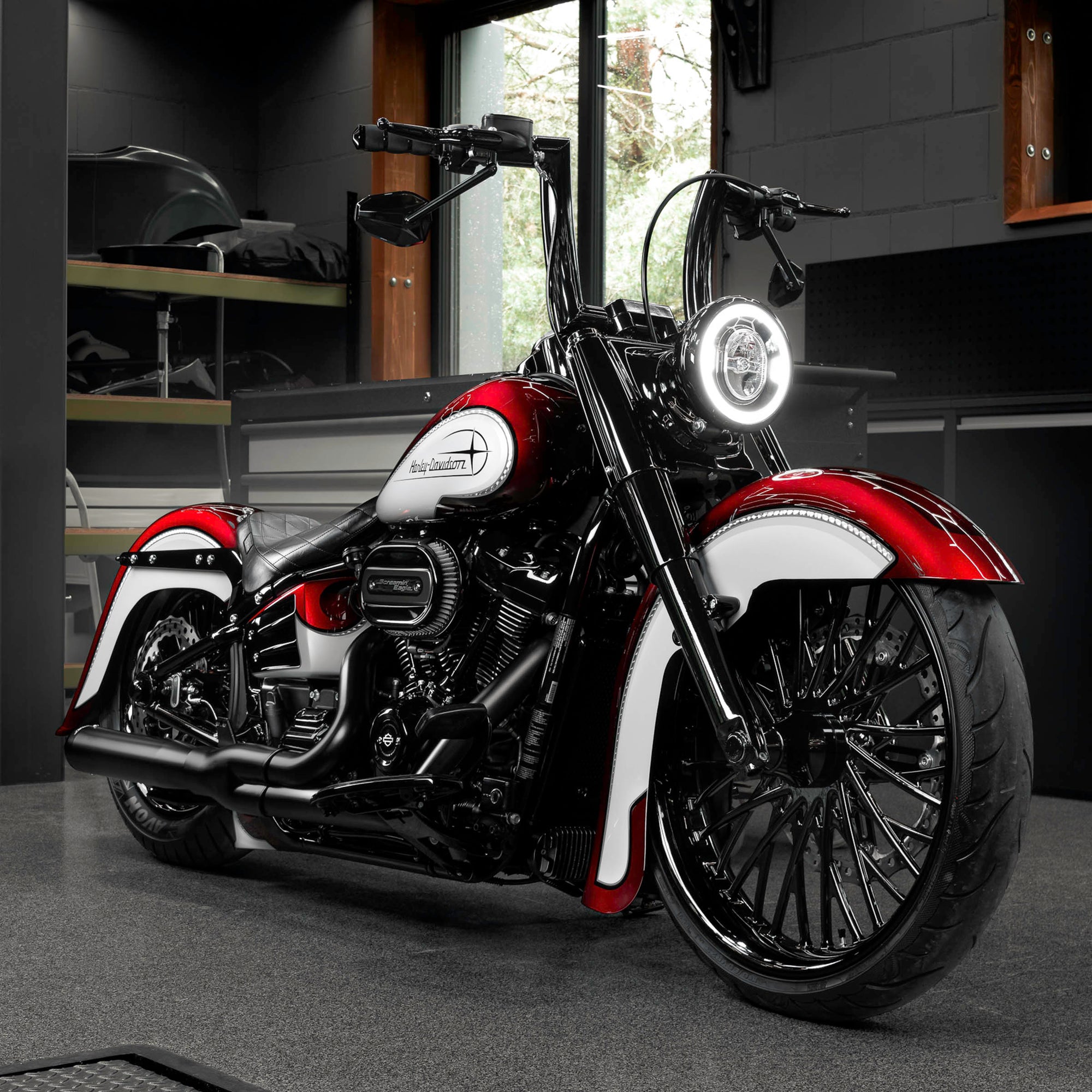 Modified Harley Davidson Heritage motorcycle with Killer Custom parts from the front in a modern bike shop