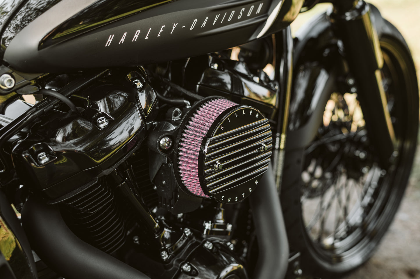 Zoomed Harley Davidson motorcycle with Killer Custom air filter cover for air cleaner kit from the side