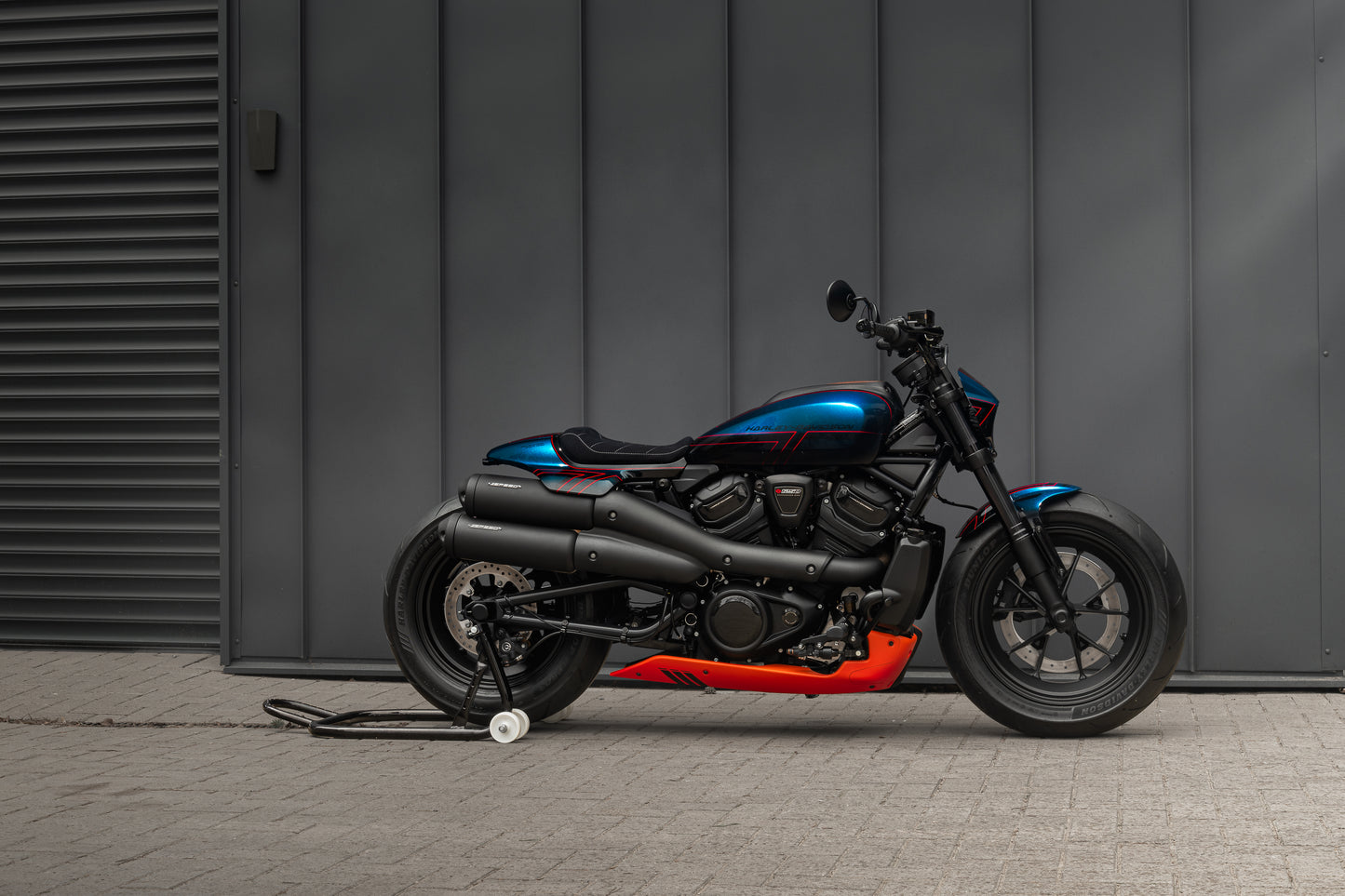 Harley Davidson motorcycle with Killer Custom headlight fairing mask form the side grey background