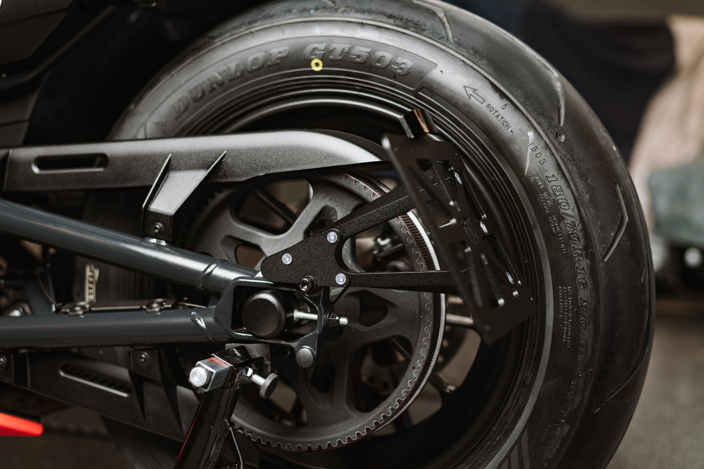 Zoomed Harley Davidson motorcycle with Killer Custom "Premium" license plate bracket from the side