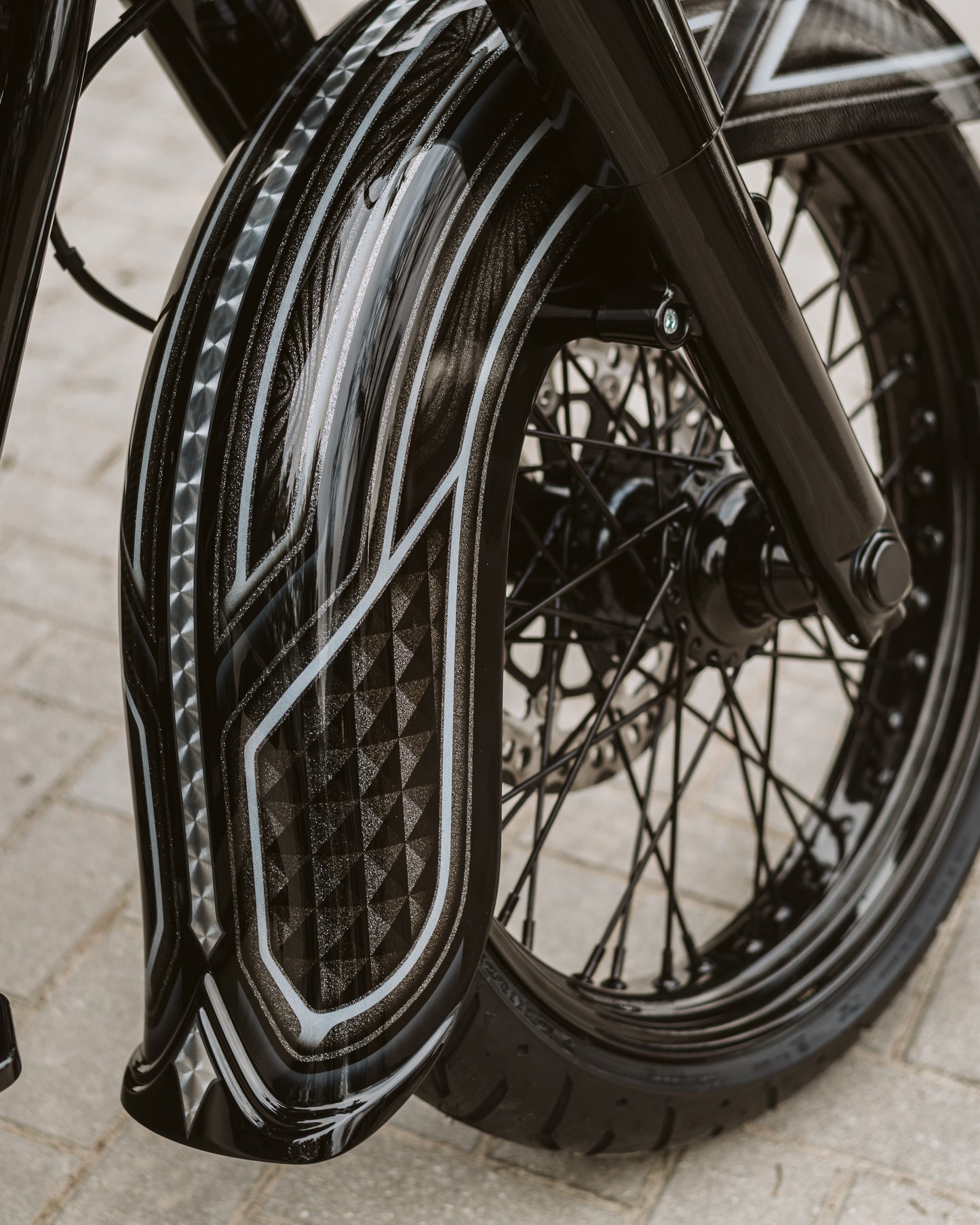 Zoomed Harley Davidson motorcycle with Killer Custom "Classic" fender for front wheel  neutral background