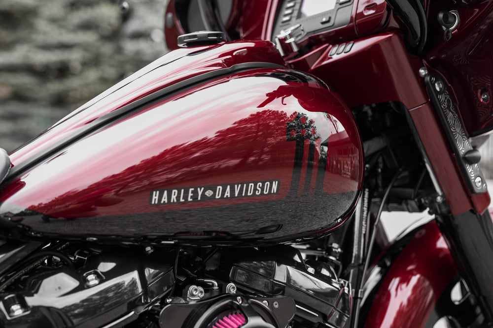 Zoomed Harley Davidson motorcycle with Killer Custom gas tank console blurred background