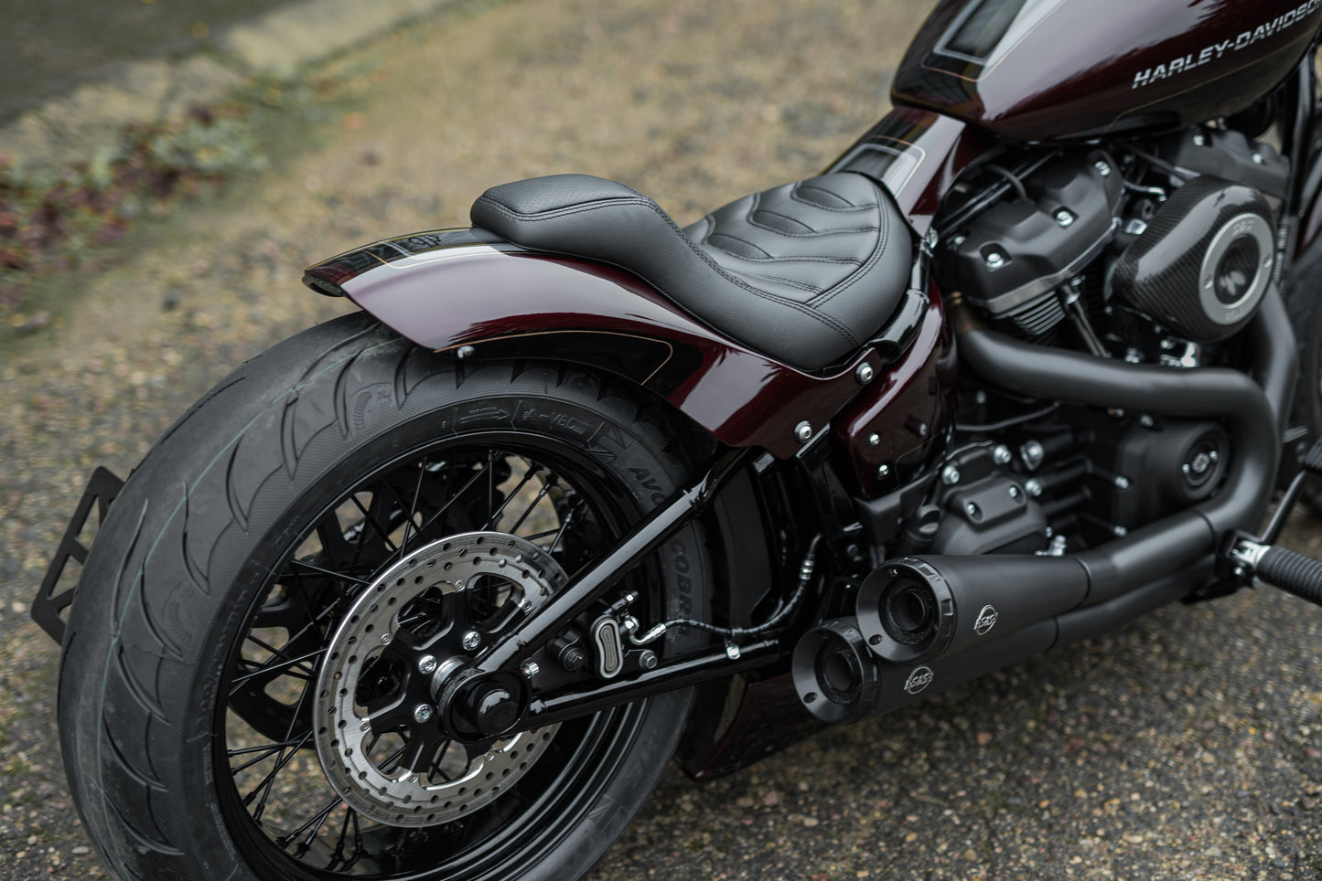 Zoomed Harley Davidson motorcycle with Killer Custom "Bobbstr" rear fender from the rear