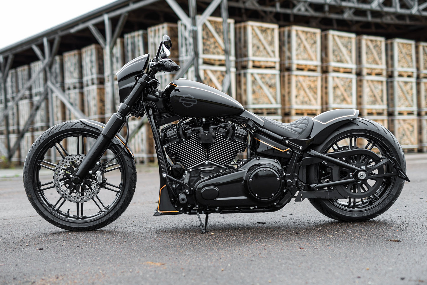 Harley Davidson motorcycle with Killer Custom front brake rotor from the side in an industrial environment