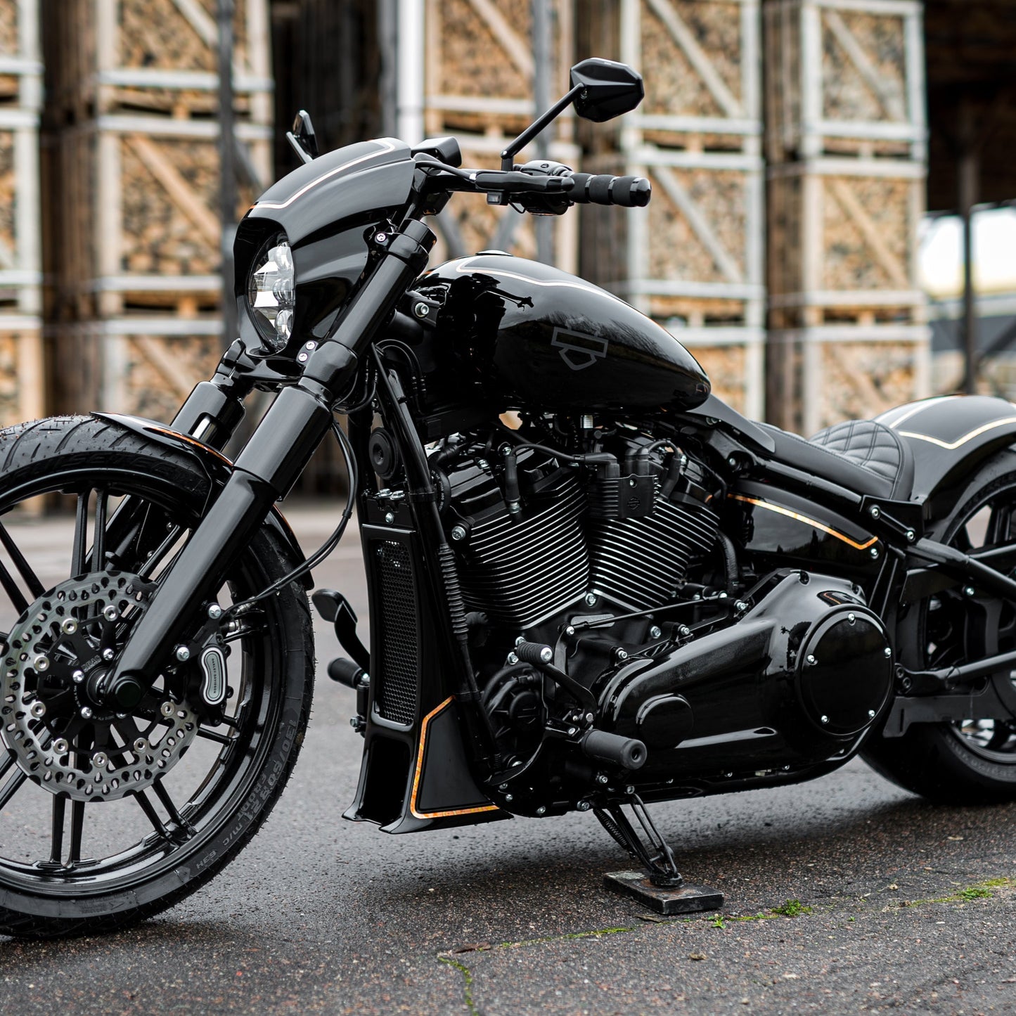 Harley Davidson motorcycle with "Aggressor" series radiator cover from the side in an industrial environment