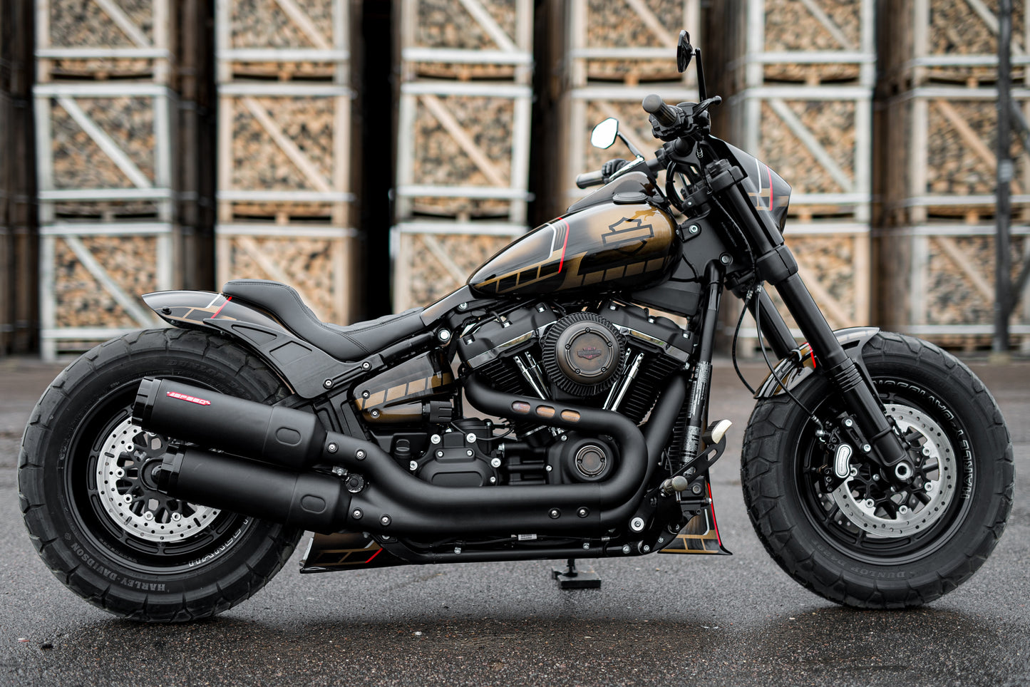 Harley Davidson motorcycle with back frame spoiler from the side in an industrial environment