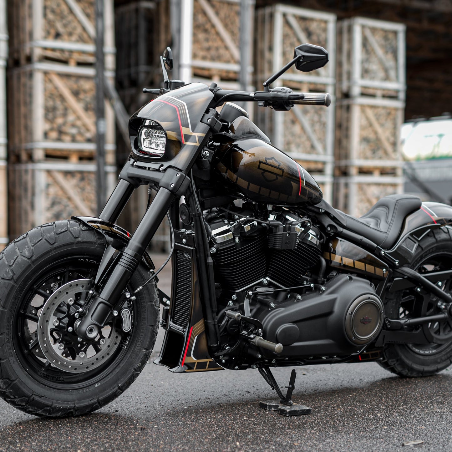 Harley Davidson motorcycle with "Aggressor" series radiator cover from the side in an industrial environment