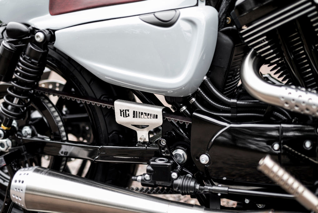 Zoomed Harley Davidson motorcycle with Killer Custom belt cover from the side