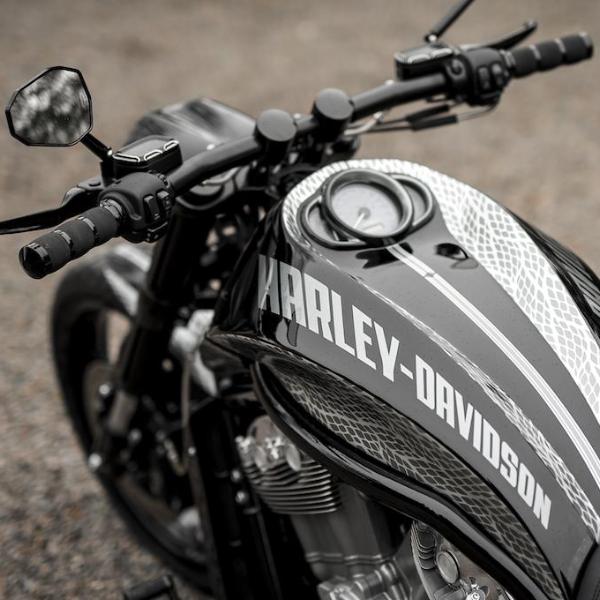 Zoomed Harley Davidson motorcycle with Killer Custom fat drag V-Rod handlebar from above neutral blurry background