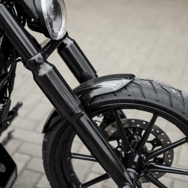 Zoomed Harley Davidson motorcycle with Killer Custom front fender from the front 