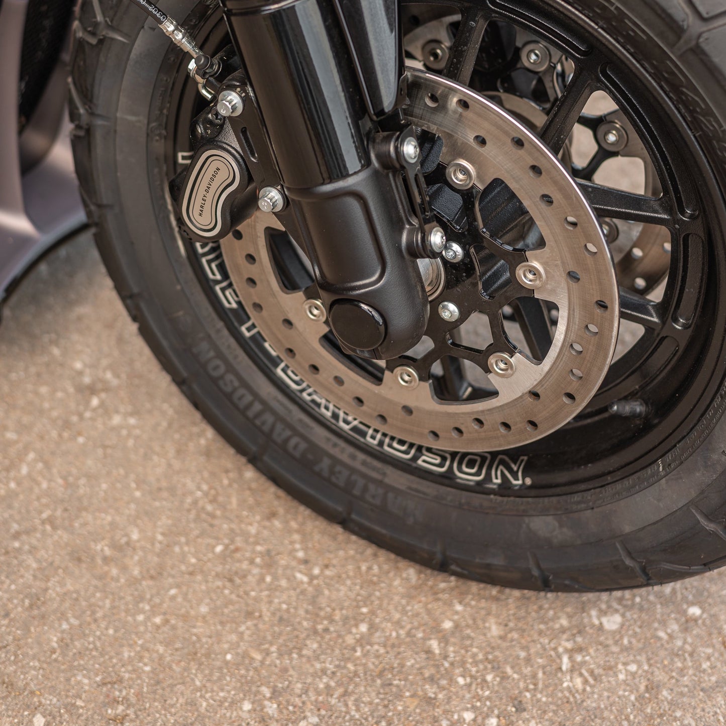 Zoomed Harley Davidson motorcycle with Killer Custom front axle cover set for fork assemblies