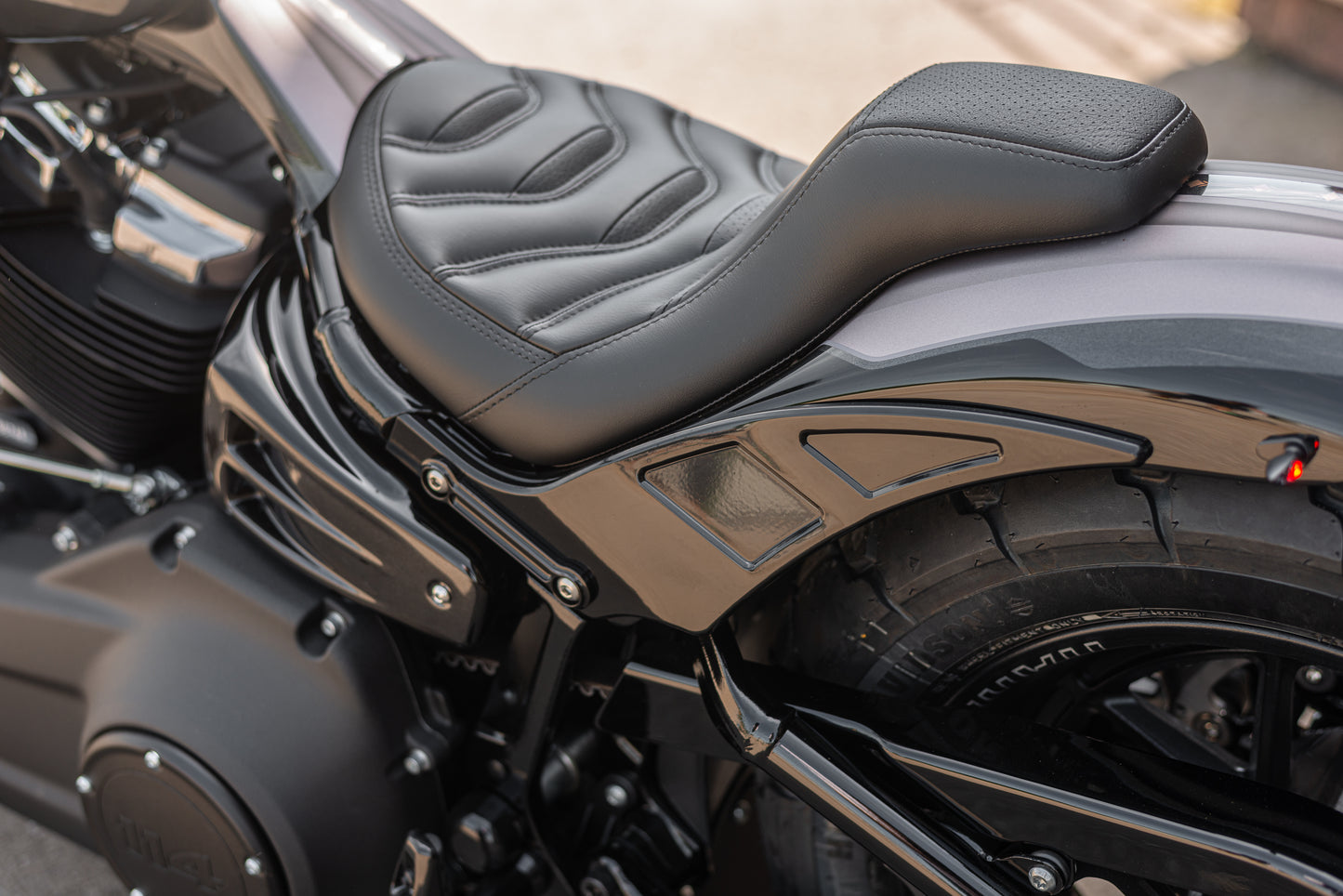 Zoomed Harley Davidson motorcycle with Killer Custom "Bobbstr" rear fender from the rear side 