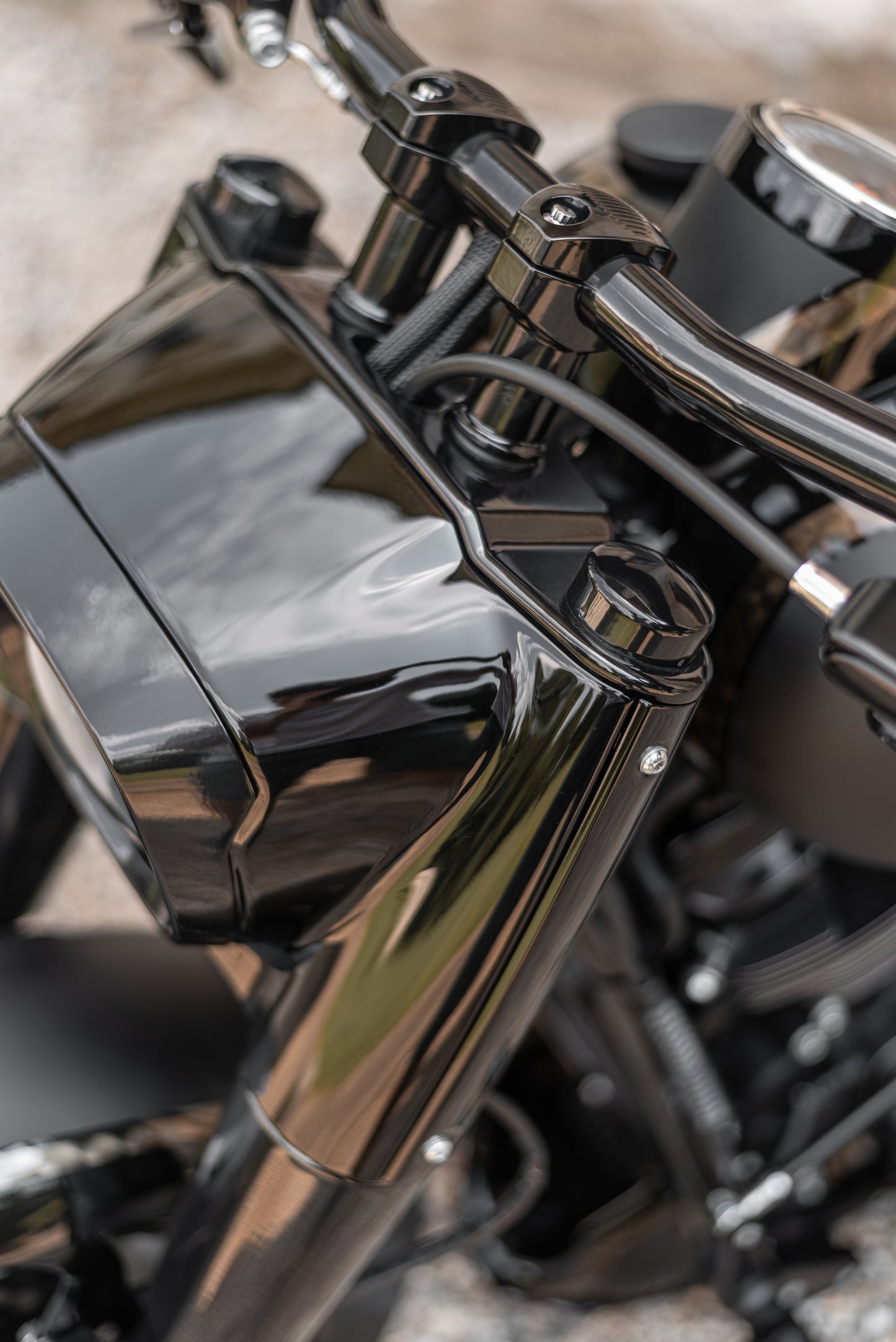 Zoomed Harley Davidson motorcycle with Killer Custom "Avenger" fat drag handlebar from above blurry background