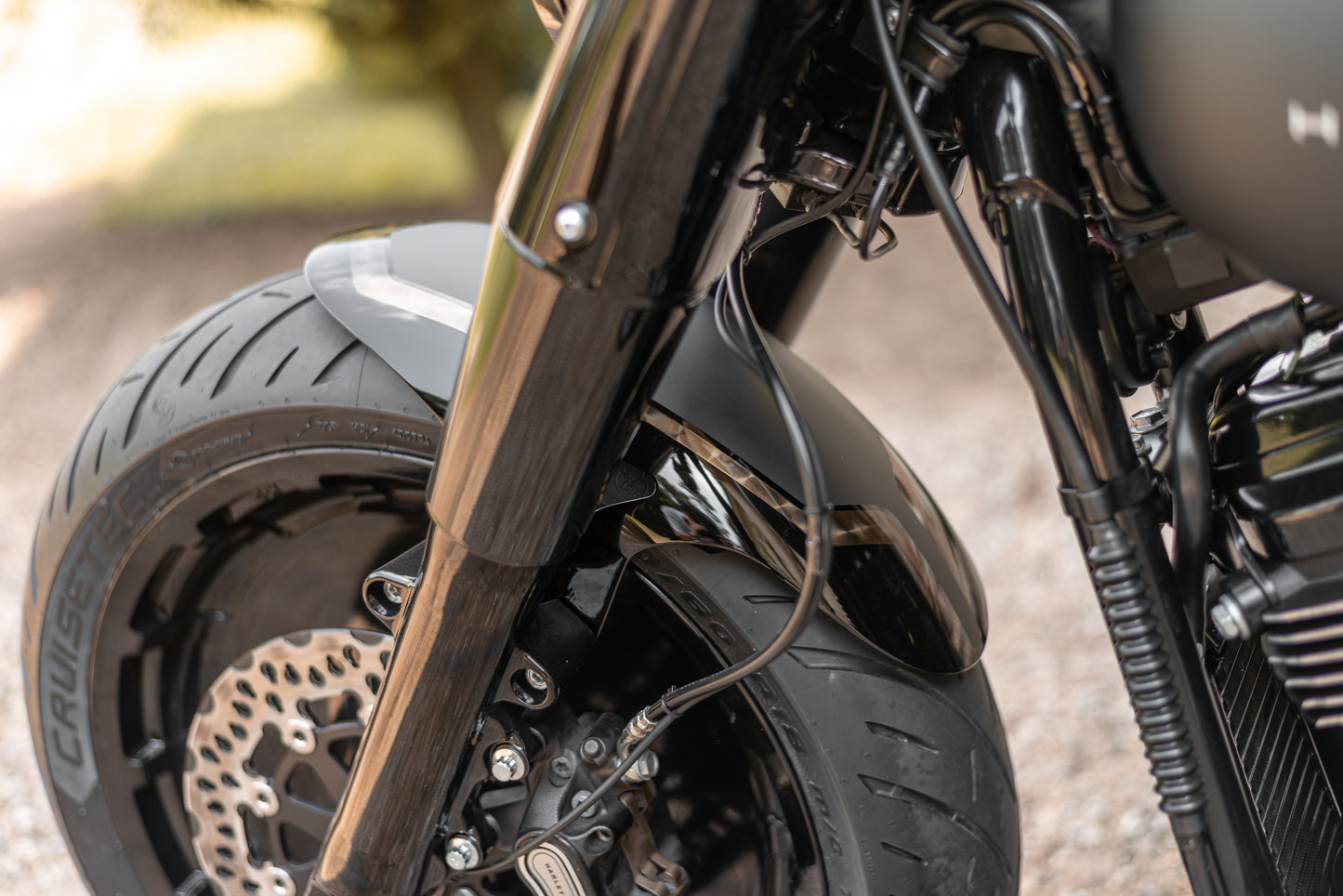 Zoomed  Harley Davidson motorcycle with Killer Custom parts blurred background