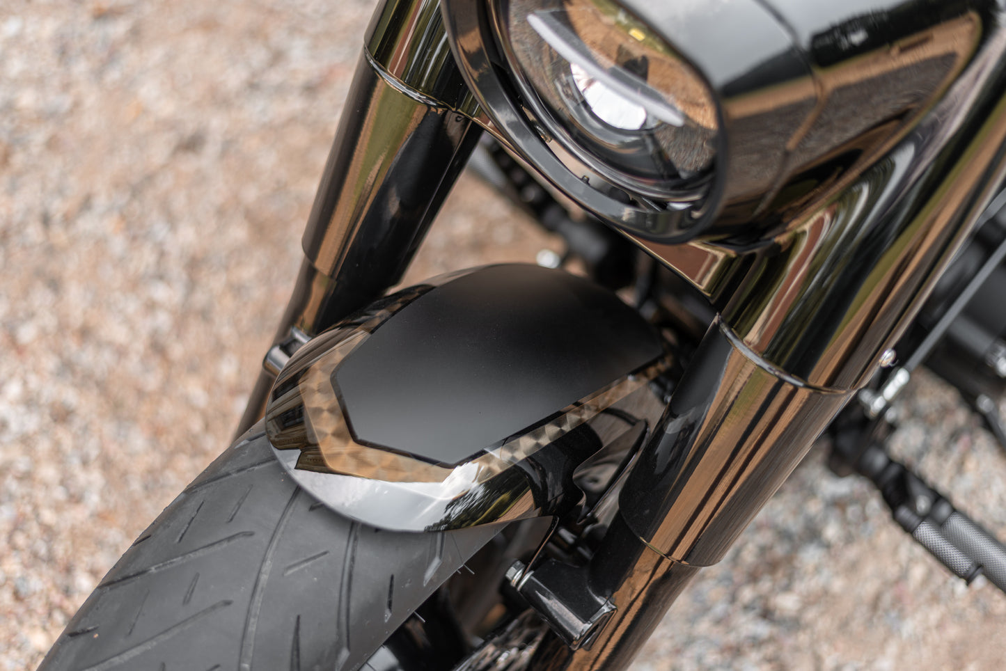 Zoomed  Harley Davidson motorcycle with Killer Custom parts from above blurred background