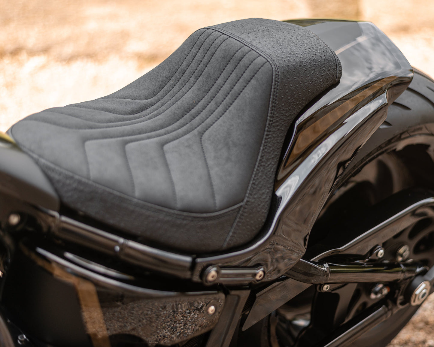 Zoomed Harley Davidson motorcycle with Killer Custom parts blurry background