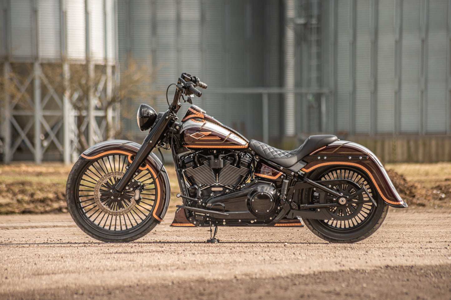 Harley Davidson motorcycle with Killer Custom rear fender with tip from the side in an industrial environment