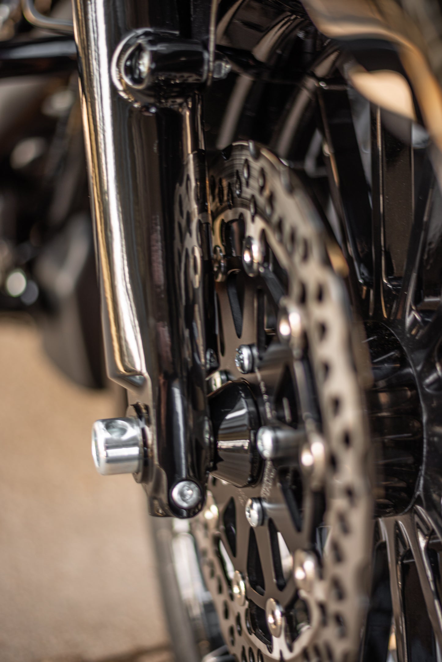 Zoomed Harley Davidson motorcycle with Killer Custom front wheel spacer