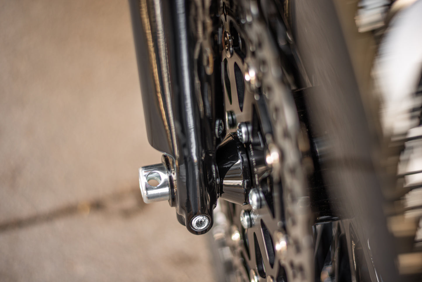 Zoomed Harley Davidson motorcycle with Killer Custom front wheel spacer blurry background