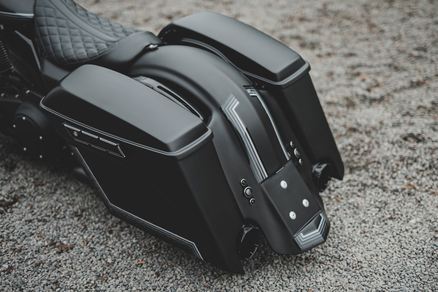 Harley Davidson motorcycle with Killer Custom running/brake/turn signals from the rear outside on a gloomy day blurry background