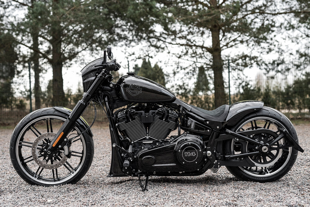  Harley Davidson motorcycle with Killer Custom front fender from the side with some trees in the background
