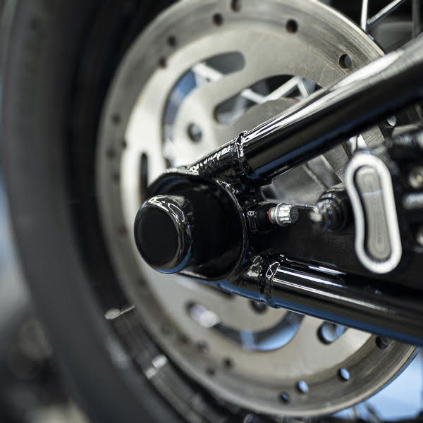 Zoomed Harley Davidson motorcycle with Killer Custom rear axle cover set