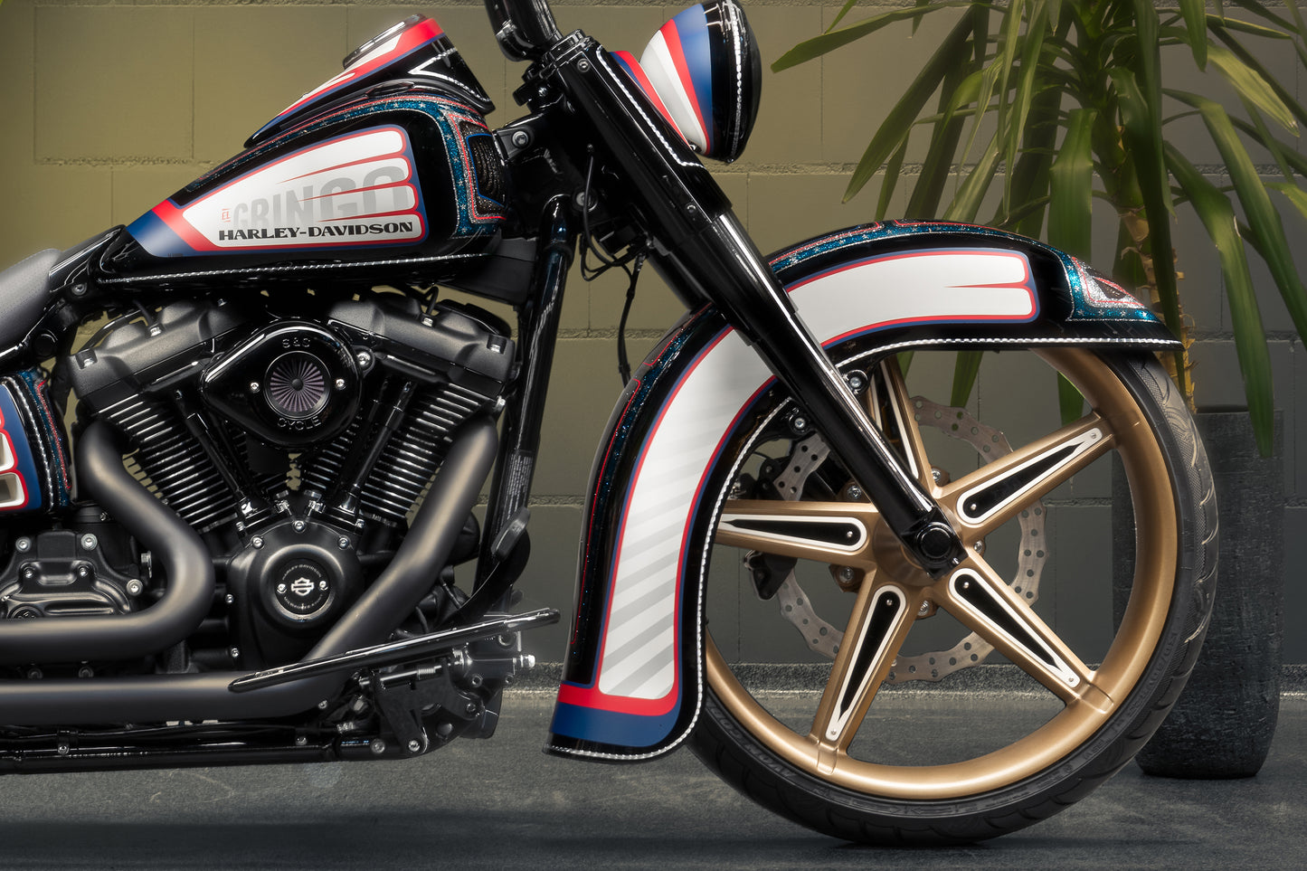 Harley Davidson motorcycle with Killer Custom "Hot rod series" front fender from the side in an industrial environment