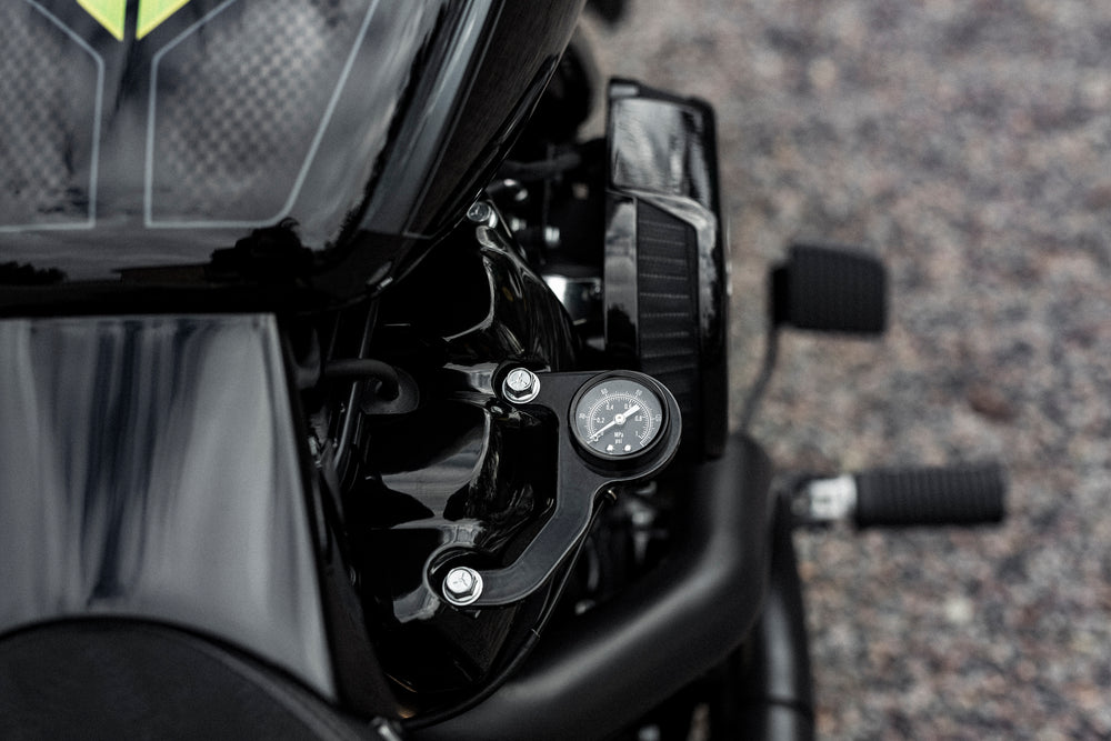 Zoomed Harley Davidson motorcycle with Killer Custom air ride pressure gauge kit blurry background